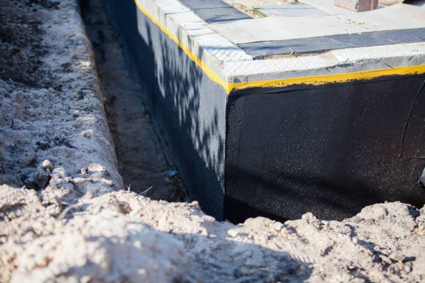 Professional Waterproofing technician working in Milroy, IN